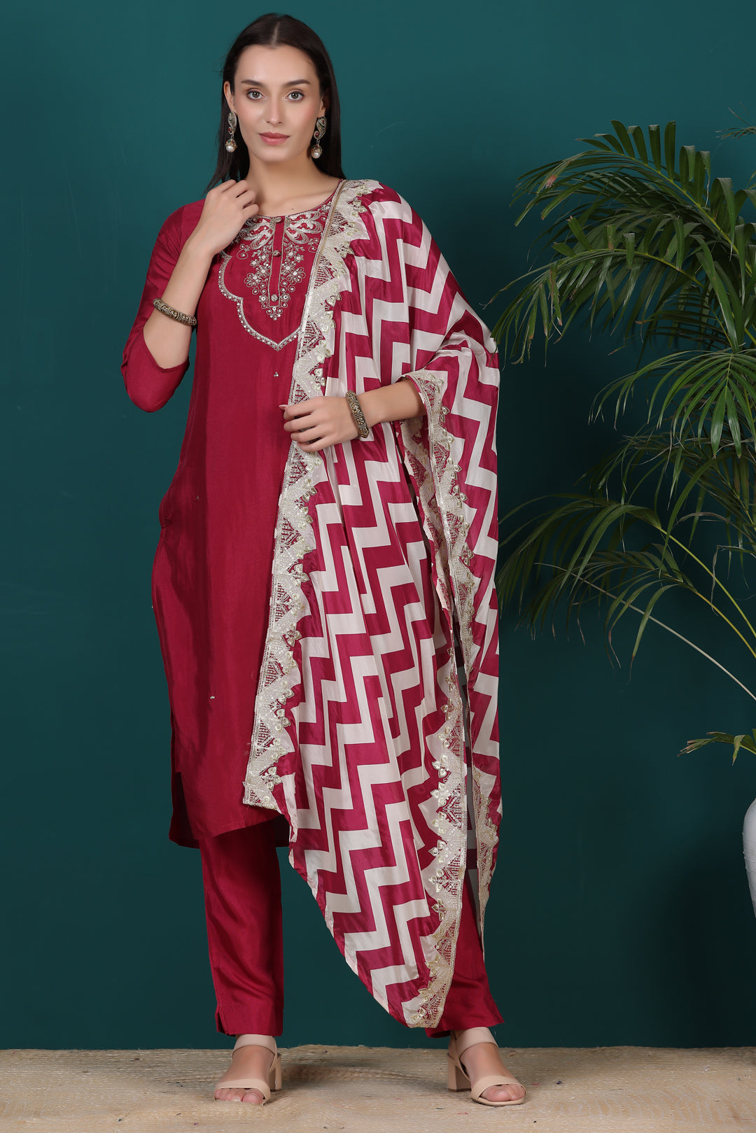 Model wearing a Red Salwar Suit