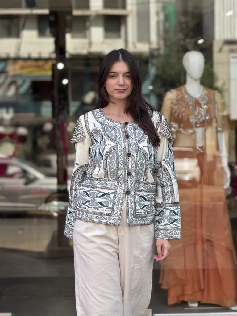 Fabric and fall detail in white jacket — White Jacket