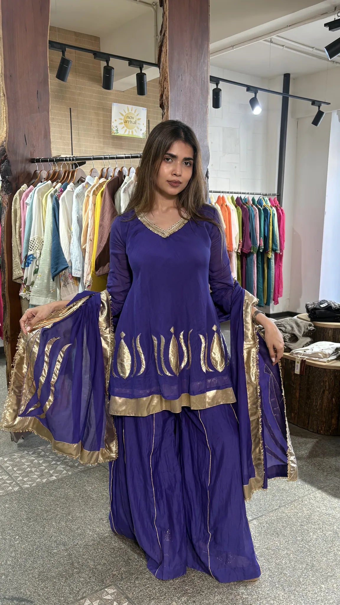 Violet mul chanderi short kurta with a gold-bordered plazo, dupatta falling down one side, shot in the Ethonique boutique.